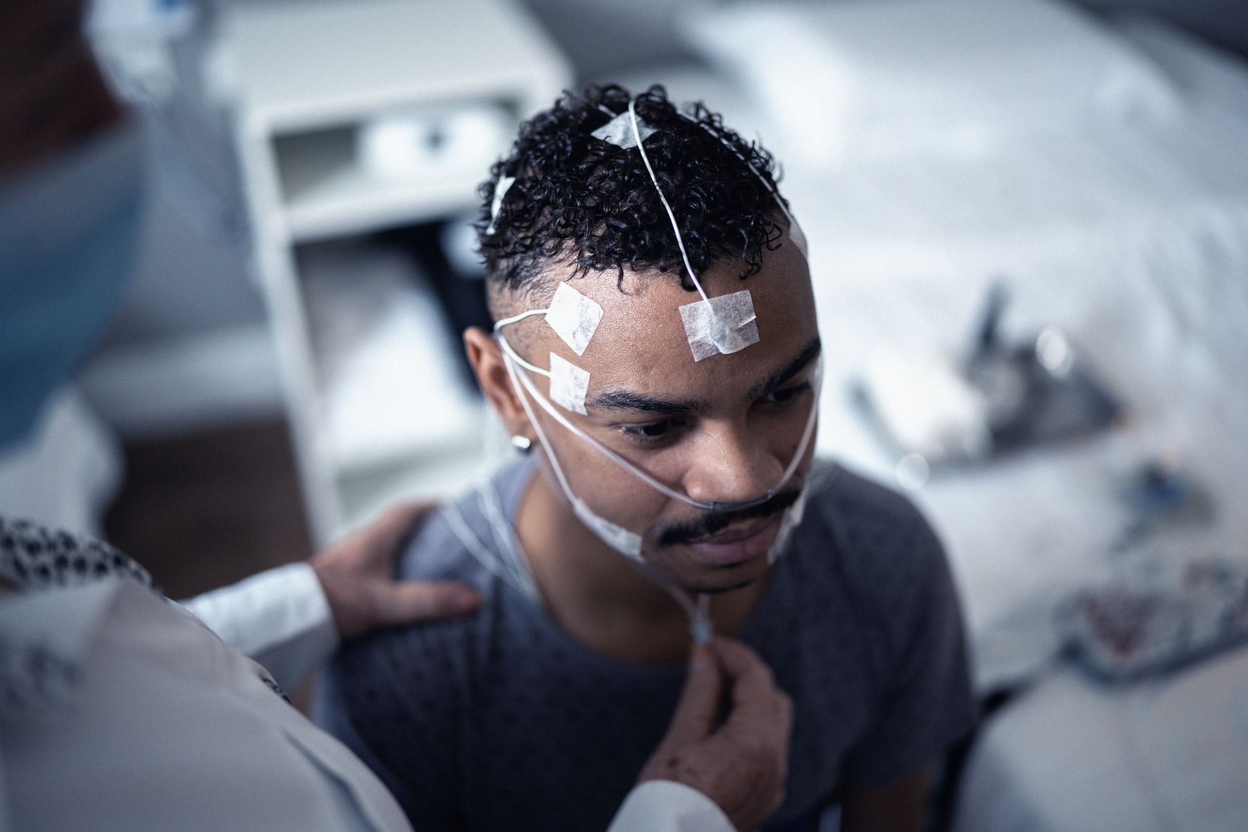 A sleep apnea patient with surface electrodes on